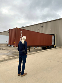Image of Tom standing in front of our Ukrainian bound container